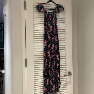 Off the shoulder flowy black dress with red flowers, green leaves